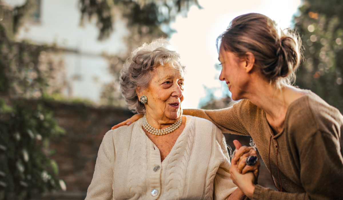 Two women smiling at eachother 