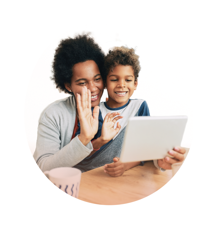 miling mother and child engaging in a joyful video chat.