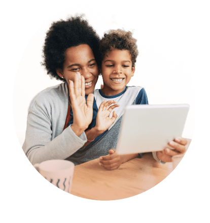 miling mother and child engaging in a joyful video chat.